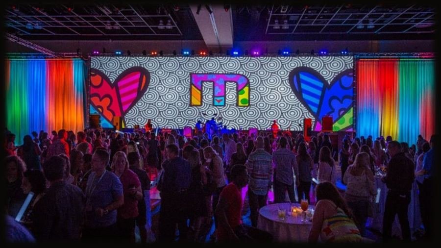 Branded networking event with colorful custom LED backdrop