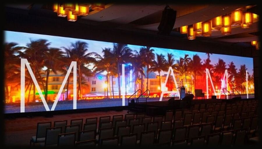 Large-format curved LED video wall displaying custom content
